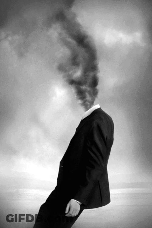 A Man With Smoke Coming Out Of His Head In A Black And White Photo GIF
