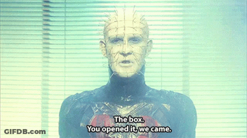 A Man With Spikes On His Head Is Standing In Front Of A Window And Says The Box You Opened It We Came GIF
