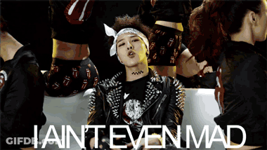 A Man With Spikes On His Jacket Is Surrounded By Women And The Words Iain 'T Even Mad GIF
