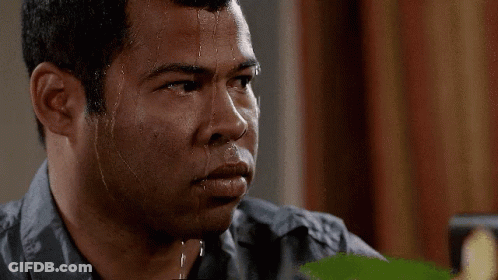 A Man With Sweat Running Down His Face Is Looking Down GIF