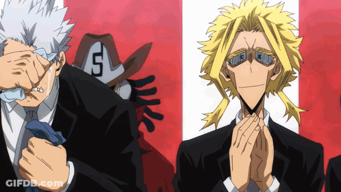 A Man With The Letter S On His Hat Is Standing Next To Another Man GIF