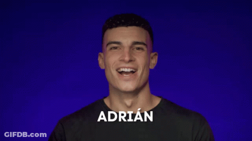 A Man With The Name Adrian On His Shirt Smiles GIF