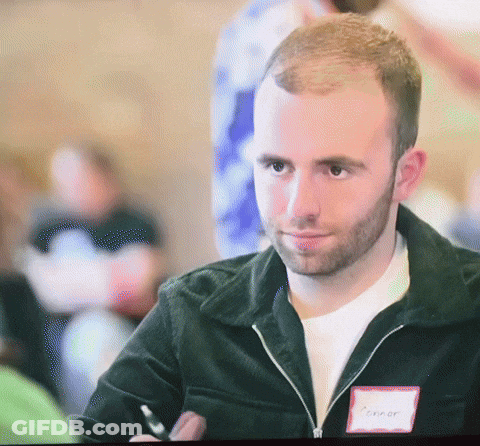 A Man With The Name Connor On His Name Tag GIF
