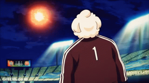 A Man With The Number 1 On His Back Stands In Front Of A Stadium GIF