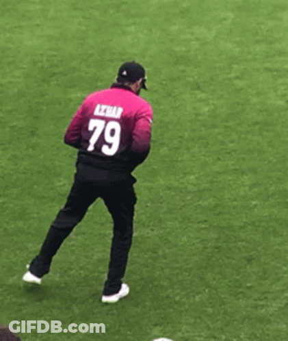 A Man With The Number 79 On His Back Is Standing On One Leg GIF