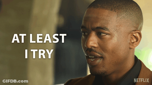 A Man With The Words At Least I Try On The Bottom GIF
