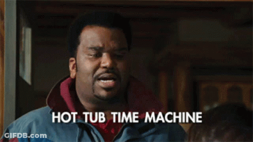 A Man With The Words Hot Tub Time Machine Written On His Chest GIF