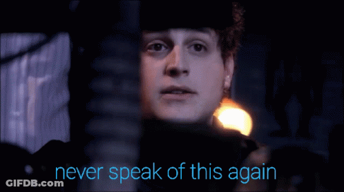 A Man With The Words Never Speak Of This Again Written Below Him GIF