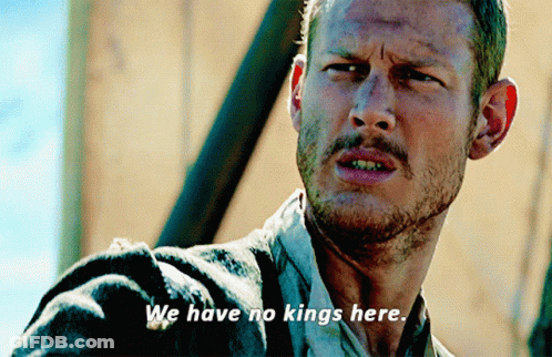 A Man With The Words We Have No Kings Here Written On His Face GIF