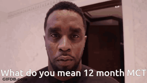 A Man With The Words What Do You Mean 12 Month Mct On The Bottom GIF