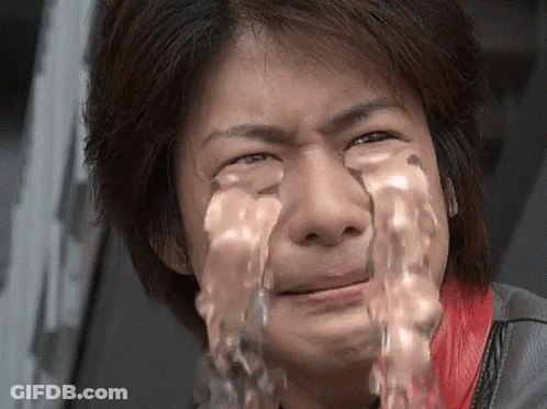 A Man With Water Coming Out Of His Eyes Is Crying GIF