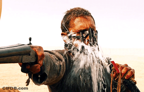A Man With Water Coming Out Of His Mouth And A Gun GIF