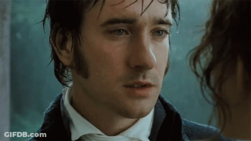 A Man With Wet Hair Looks At A Woman GIF