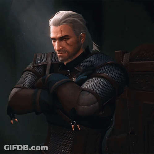 A Man With White Hair And A Beard Is Wearing A Chain Mail Armor GIF