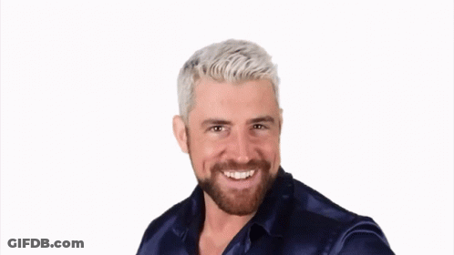 A Man With White Hair And A Beard Wearing A Blue Shirt GIF