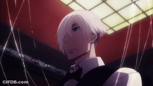 A Man With White Hair And A Bow Tie Is Holding A String Around His Neck . GIF