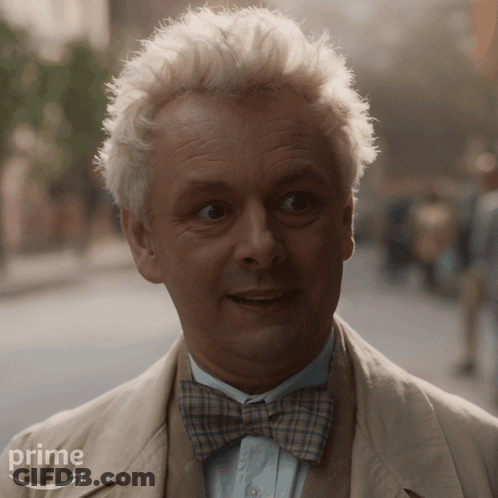 A Man With White Hair And A Bow Tie Is Wearing A Suit And Tie From Prime GIF