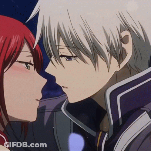 A Man With White Hair And A Woman With Red Hair Are Looking At Each Other GIF
