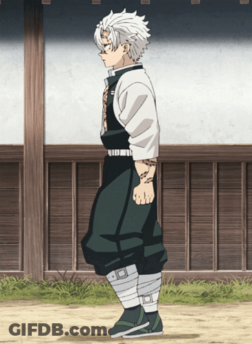 A Man With White Hair And Green Pants Is Standing In Front Of A Wooden Wall GIF