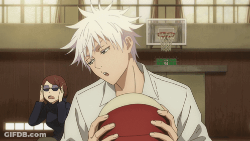 A Man With White Hair Holds A Red Basketball In His Hands GIF