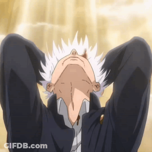A Man With White Hair Is Laying On The Floor With His Head Down GIF