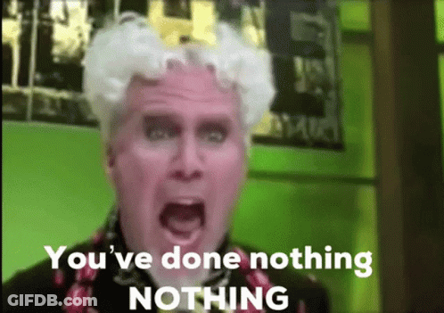 A Man With White Hair Is Screaming With The Words `` You 'Ve Done Nothing Nothing '' Behind Him . GIF