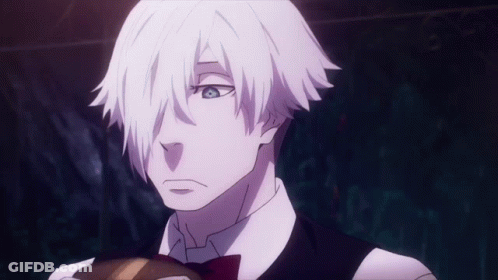 A Man With White Hair Is Wearing A Bow Tie And Vest GIF