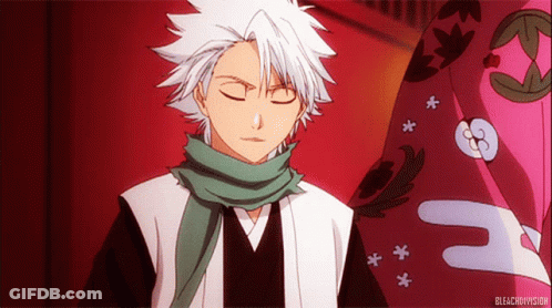 A Man With White Hair Is Wearing A Green Scarf Around His Neck And The Word Bleach Is On The Bottom GIF