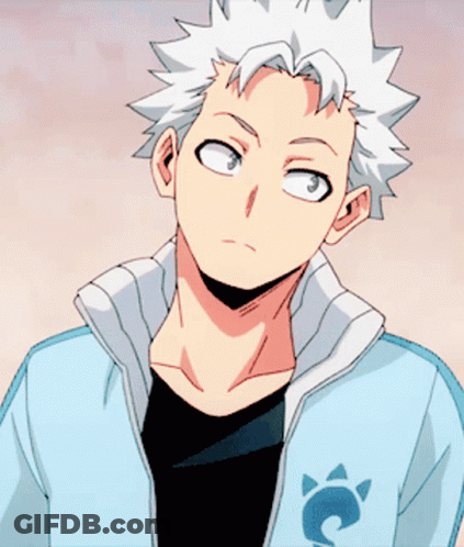 A Man With White Hair Is Wearing A Jacket With A Cat On It GIF