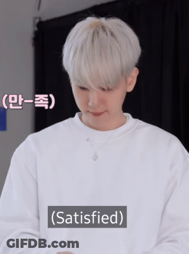 A Man With White Hair Is Wearing A White Sweater And The Word Satisfied Is Above Him GIF