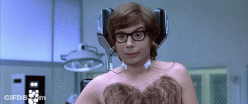 A Man Without A Shirt Has Headphones On His Head GIF