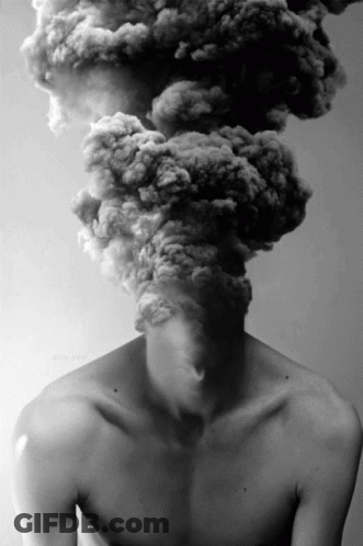 A Man Without A Shirt Has Smoke Coming Out Of His Head .. GIF