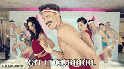 A Man Without A Shirt Is Dancing In Front Of A Group Of People With The Words Git It Gurrrl Written On The Bottom GIF