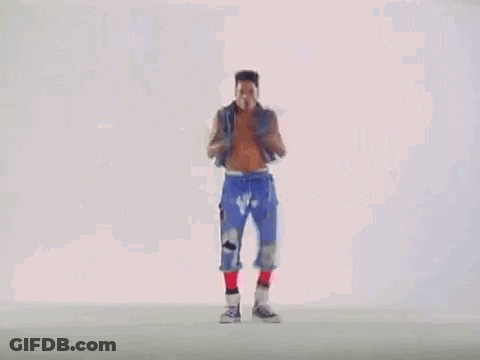A Man Without A Shirt Is Dancing On A White Surface . GIF