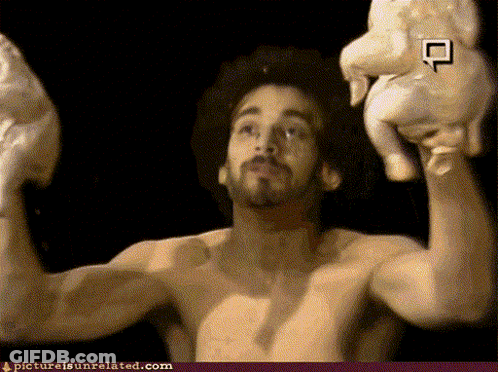 A Man Without A Shirt Is Holding A Chicken In His Hands With A Picture Is Unrelated.com Link Below GIF