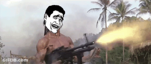 A Man Without A Shirt Is Holding A Gun And Making A Funny Face In Front Of Palm Trees . GIF