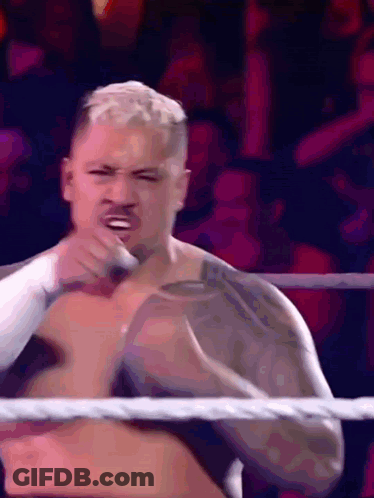 A Man Without A Shirt Is In A Wrestling Ring Making A Face GIF