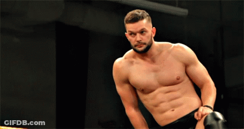 A Man Without A Shirt Is Kneeling Down In A Boxing Ring GIF