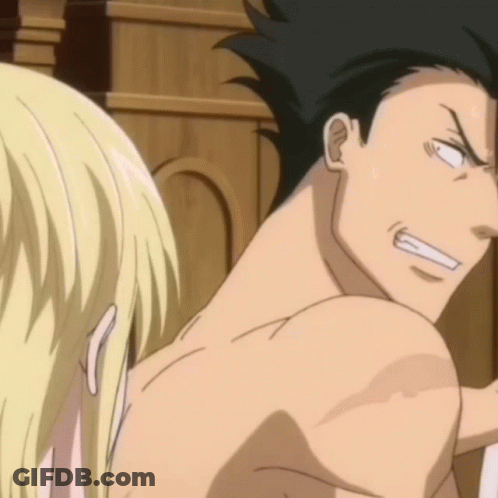 A Man Without A Shirt Is Looking At A Blonde Woman GIF