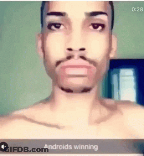 A Man Without A Shirt Is Looking At The Camera With The Words Androids Winning Below Him GIF