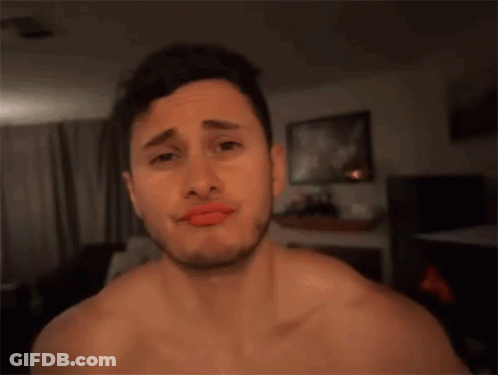 A Man Without A Shirt Is Making A Funny Face GIF