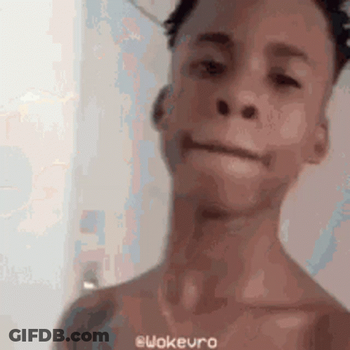 A Man Without A Shirt Is Making A Funny Face In A Blurry Photo . GIF