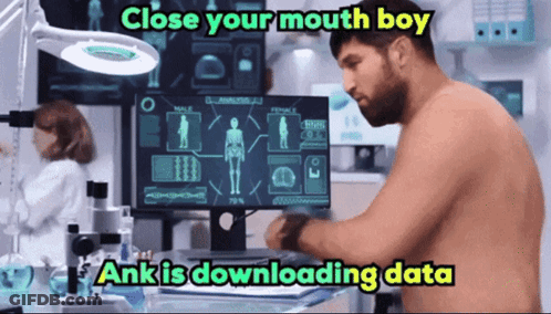 A Man Without A Shirt Is Sitting In Front Of A Computer Screen With The Words Close Your Mouth Boy Written Above Him GIF