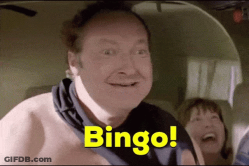 A Man Without A Shirt Is Smiling And Says Bingo GIF