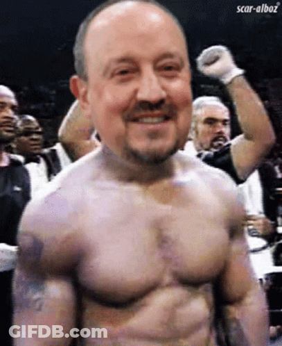 A Man Without A Shirt Is Smiling With Scar-Alboz Written In The Corner GIF