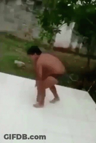 A Man Without A Shirt Is Squatting Down On A White Surface . GIF