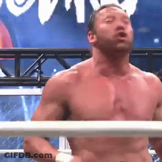 A Man Without A Shirt Is Standing In A Boxing Ring With His Eyes Closed GIF