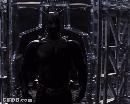 A Man Without A Shirt Is Standing In Front Of A Mirror Looking At Himself GIF