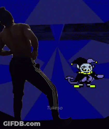 A Man Without A Shirt Is Standing In Front Of A Pixelated Clown . GIF