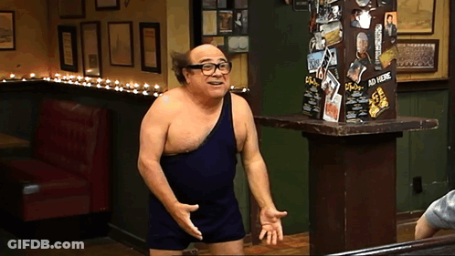 A Man Without A Shirt Is Standing In Front Of A Sign That Says ' Ad Here ' GIF